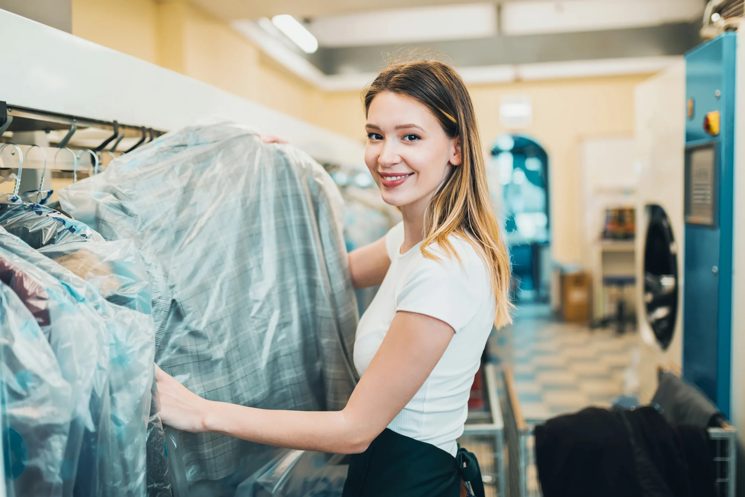 young-female-worker-dry-cleaning-salon